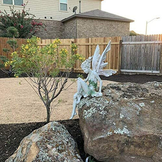 Lisslune | Statue of sitting fairy in the garden