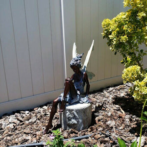 Lisslune | Statue of sitting fairy in the garden