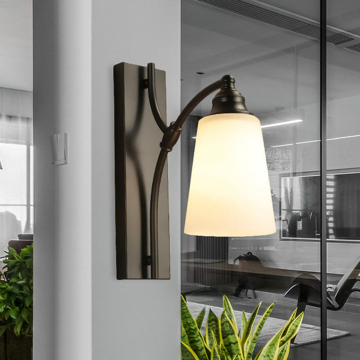 Skørter | Classic conical wall-mounted lamp with a matte glass wall light fixture in black