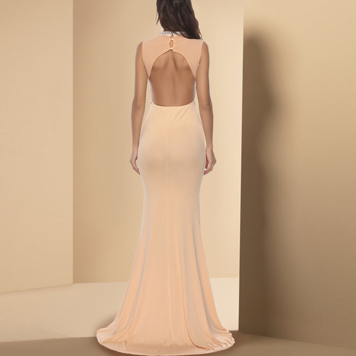 Ladies Elegant form-fitting maxi dress with deep slit and sparkling décolleté