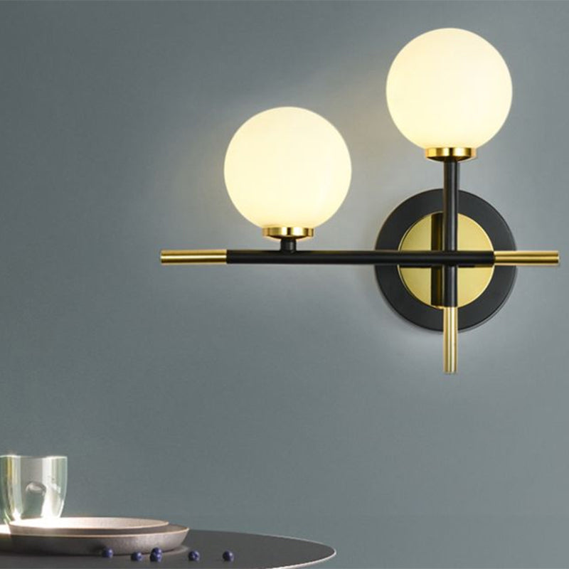 Lisslune | Milk glass orb wall light with cross design 2 lights modern black and brass wall light