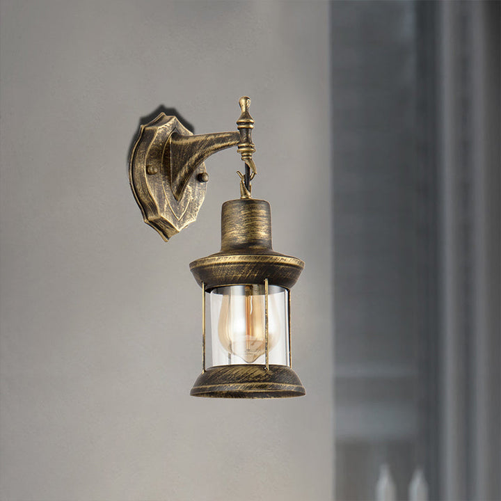 Lisslune | An E27 wall light with a petroleum shade made of clear glass Traditional outdoor wall light in antique bronze