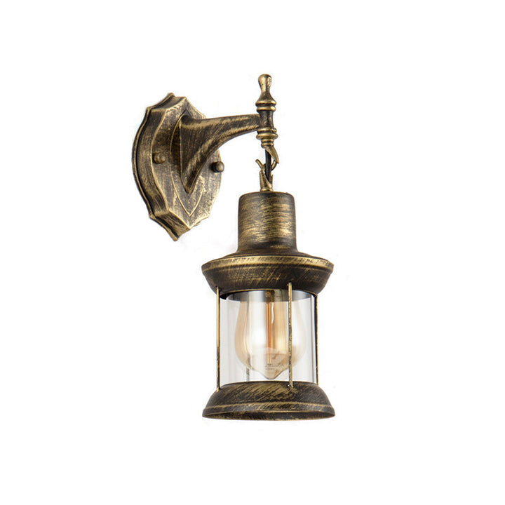 Lisslune | An E27 wall light with a petroleum shade made of clear glass Traditional outdoor wall light in antique bronze