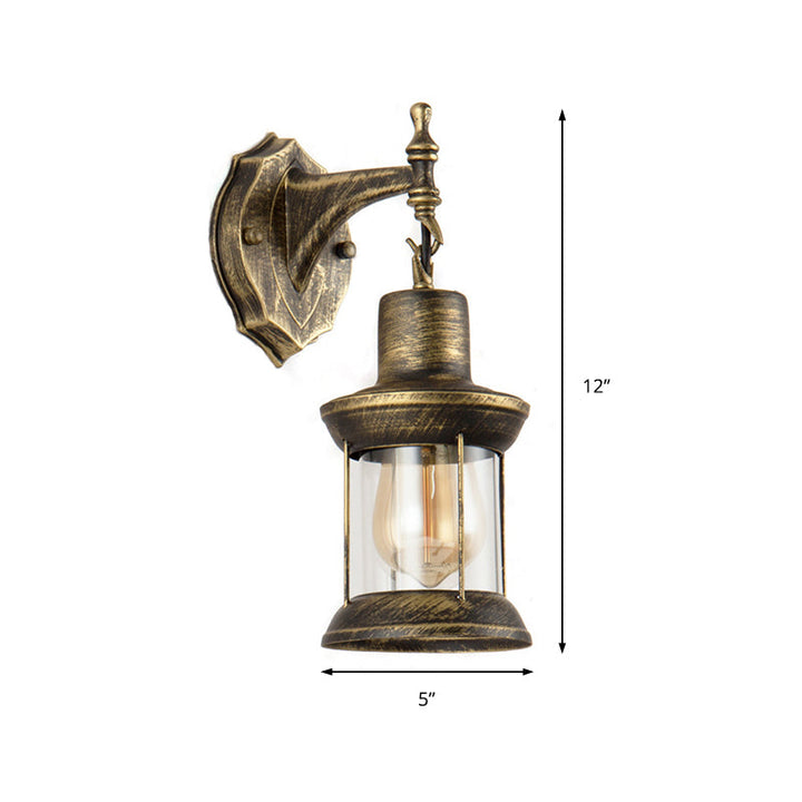 Lisslune | An E27 wall light with a petroleum shade made of clear glass Traditional outdoor wall light in antique bronze