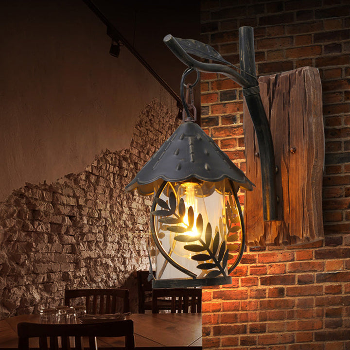 Lisslune | A wall lamp with a glass bulb and cylindrical shade made of clear glass, industrial wall lamp for the living room with leaf branch in black