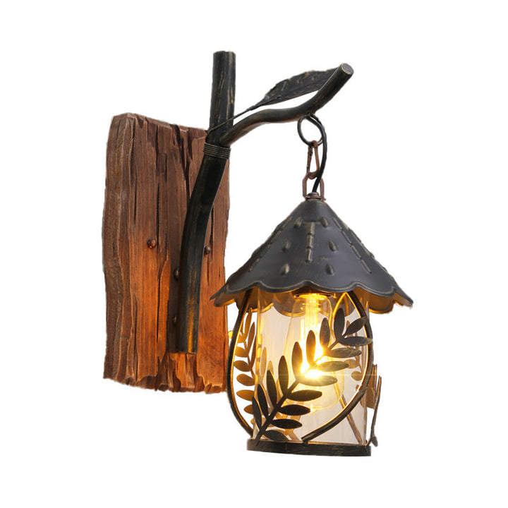 Lisslune | A wall lamp with a glass bulb and cylindrical shade made of clear glass, industrial wall lamp for the living room with leaf branch in black