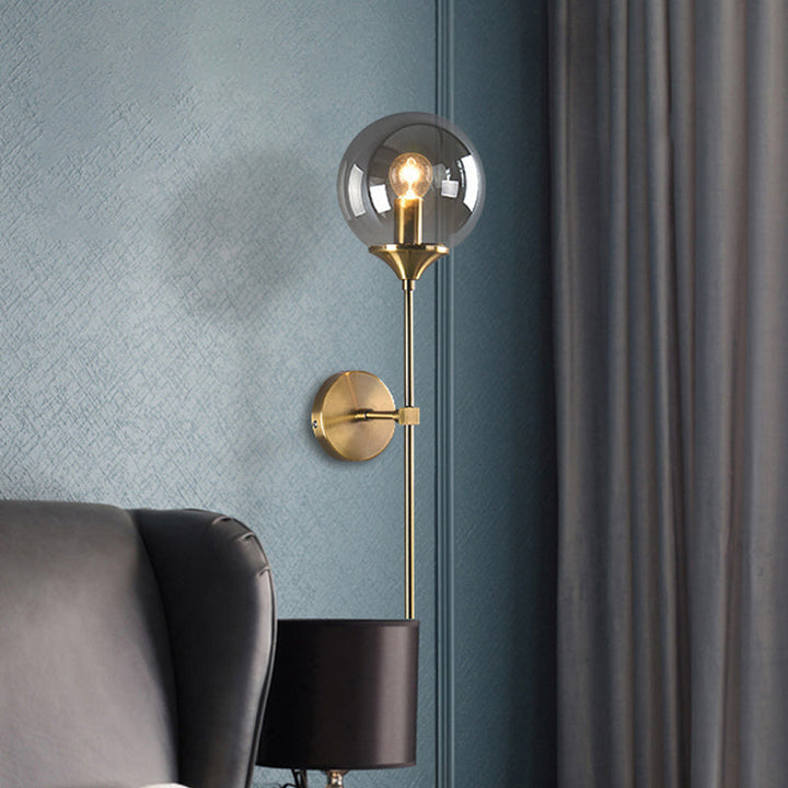 Lisslune | Simple wall lamp with a single bulb made of amber/smoke gray glass brass ball wall light fixture