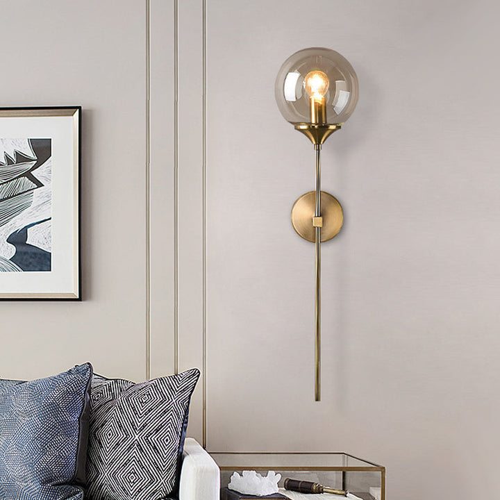 Lisslune | Simple wall lamp with a single bulb made of amber/smoke gray glass brass ball wall light fixture