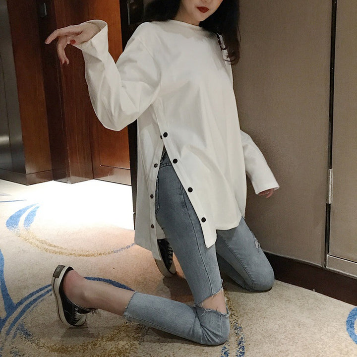 Women's long sleeve shirt with asymmetrical cut and decorative buttons