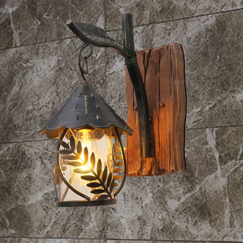 Lisslune | A wall lamp with a glass bulb and cylindrical shade made of clear glass, industrial wall lamp for the living room with leaf branch in black