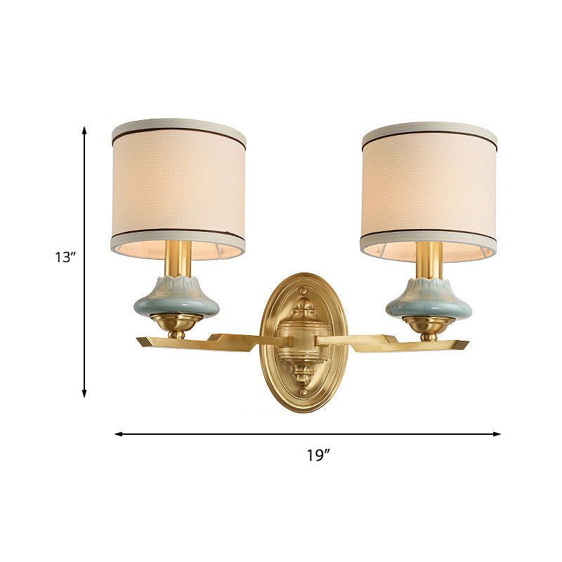 Skørter | Retro cylindrical wall lamp 1/2-light fabric wall lamp with porcelain shade in gold for porch