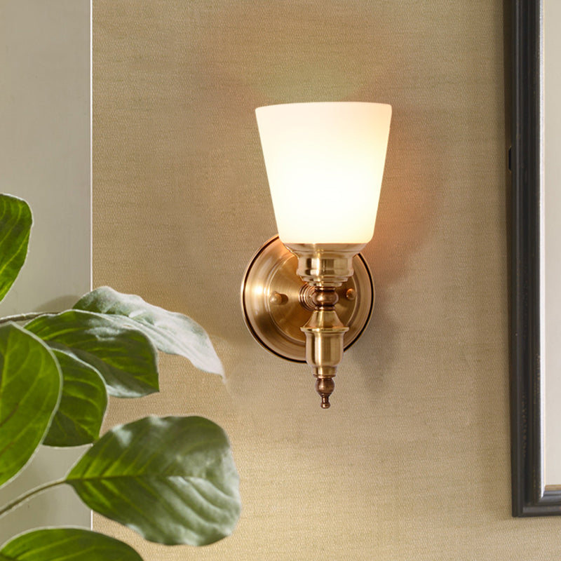 Skørter | 1-Head Wall Light with Cone Shade White Glass Modernist Style Bedroom Wall Light in Gold