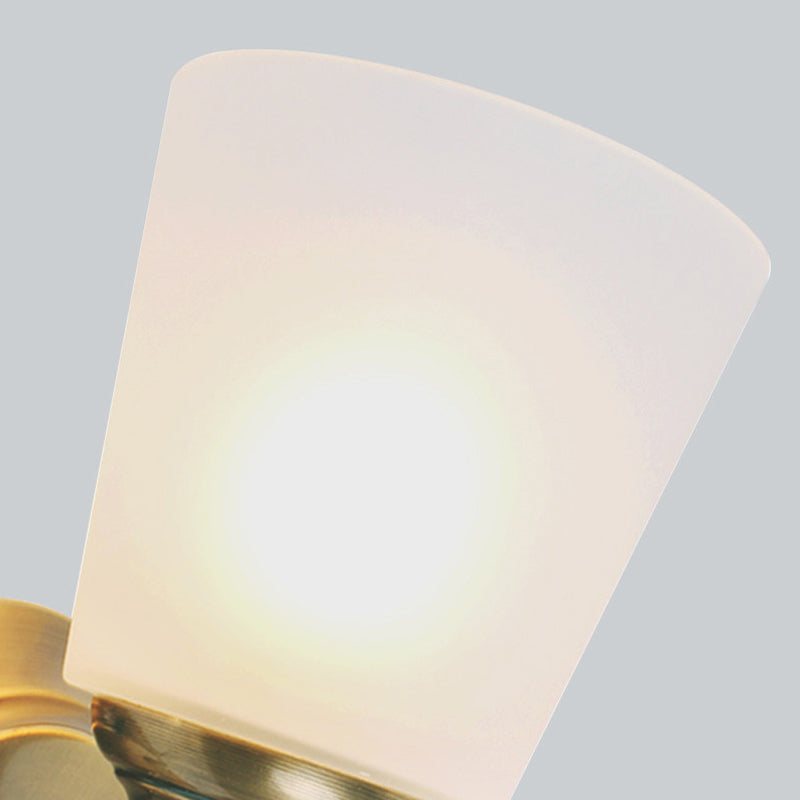 Skørter | 1-Head Wall Light with Cone Shade White Glass Modernist Style Bedroom Wall Light in Gold