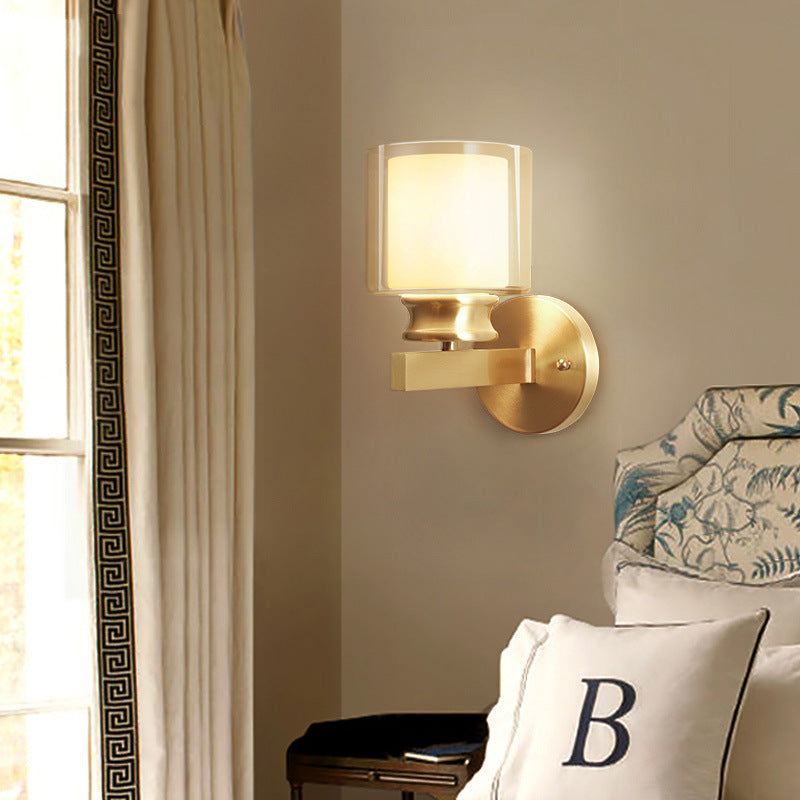 Skørter | Modern Style Cylindrical Wall Light 1 Light Clear and White Glass Wall Mount Lamp in Brass for Bedroom