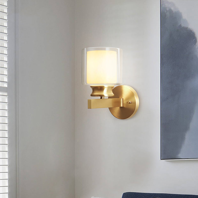Skørter | Modern Style Cylindrical Wall Light 1 Light Clear and White Glass Wall Mount Lamp in Brass for Bedroom