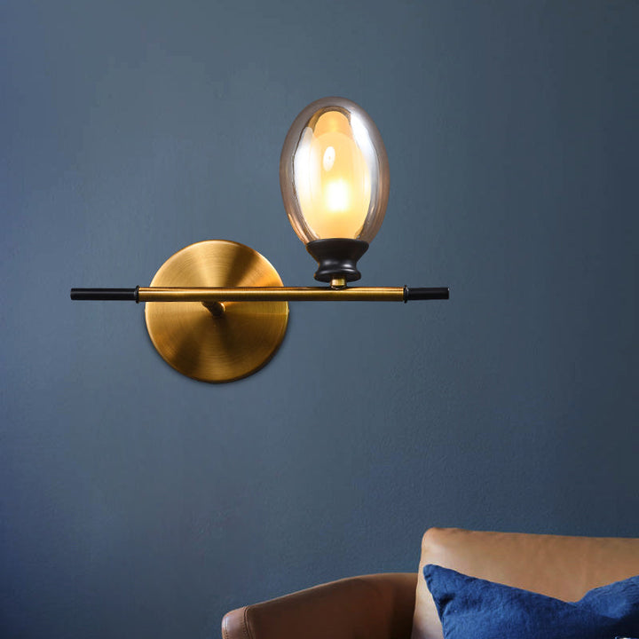 Lisslune | Clear/Amber Glass Egg Shape Wall Light Minimalist 1 Light Brass Wall Lamp with Horizontal Arm