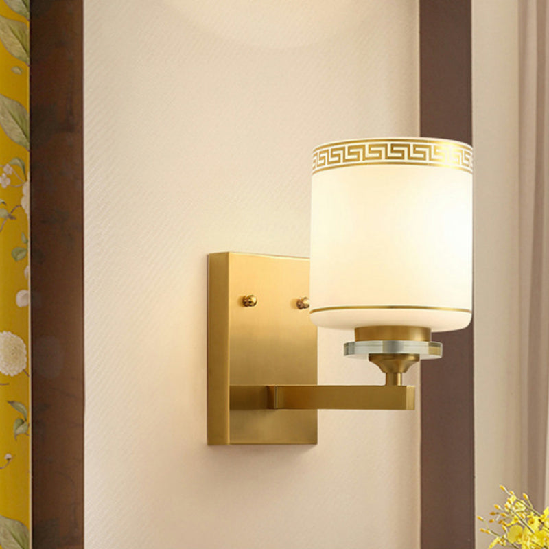 Skørter | Single Cylinder Wall Lamp Traditional Opal Frosted Glass Wall Light in Gold with Swastika Element