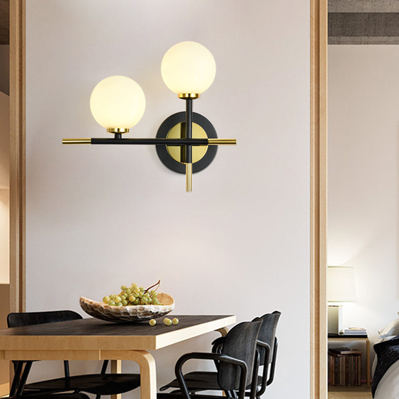 Lisslune | Milk glass orb wall light with cross design 2 lights modern black and brass wall light