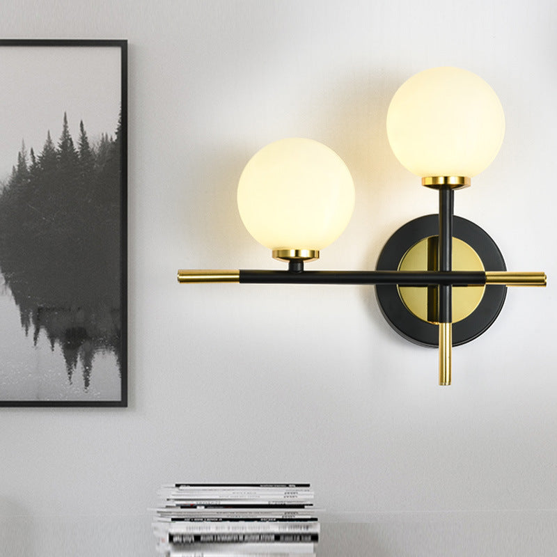 Lisslune | Milk glass orb wall light with cross design 2 lights modern black and brass wall light