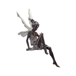Lisslune | Statue of sitting fairy in the garden