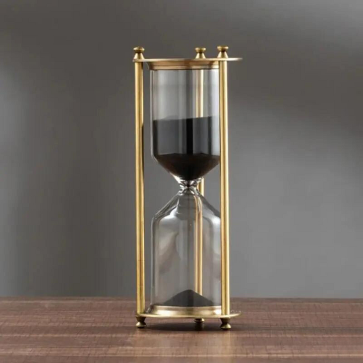 Lisslune | Antique hourglass made of brass with violet sand