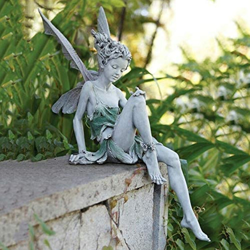 Lisslune | Statue of sitting fairy in the garden