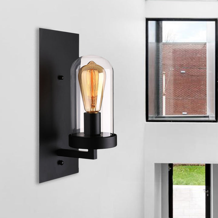 Lisslune | A wall lamp with a capsule shade made of clear glass, industrial living room wall lighting in black