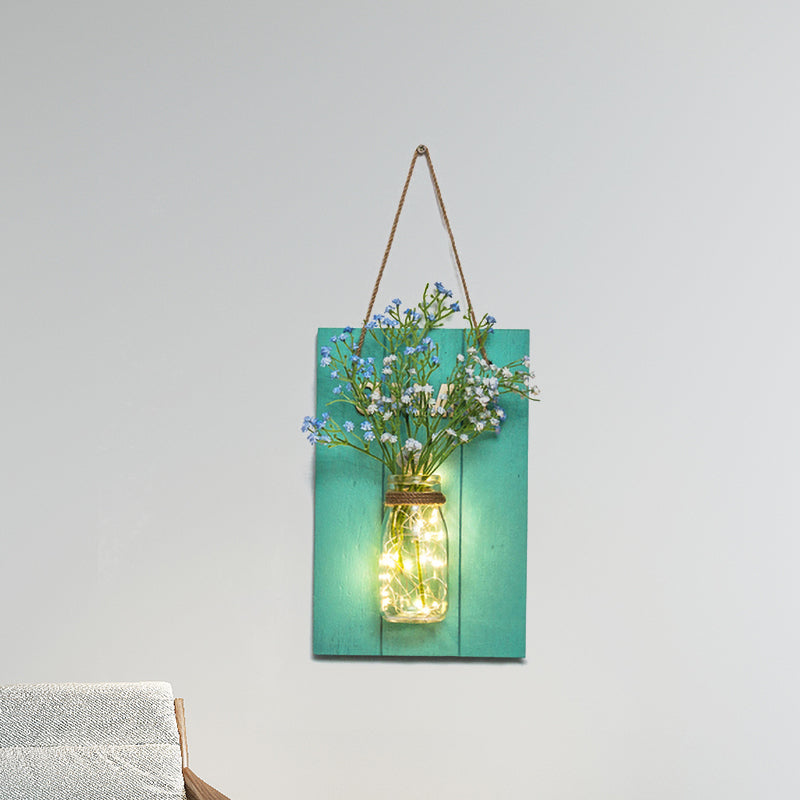 Skørter | Flower light string with blue wooden back panel modern glass container wall lamp for café restaurant