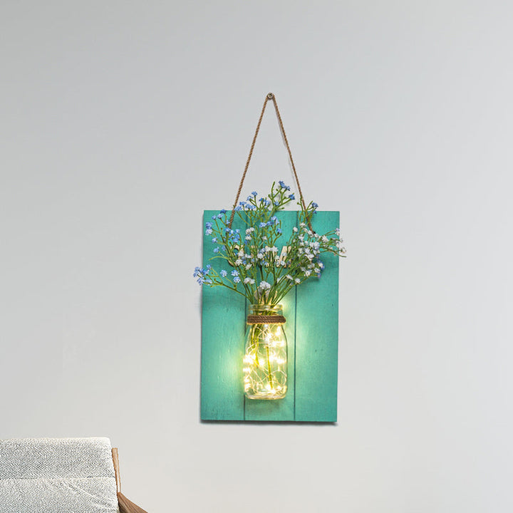Skørter | Flower light string with blue wooden back panel modern glass container wall lamp for café restaurant