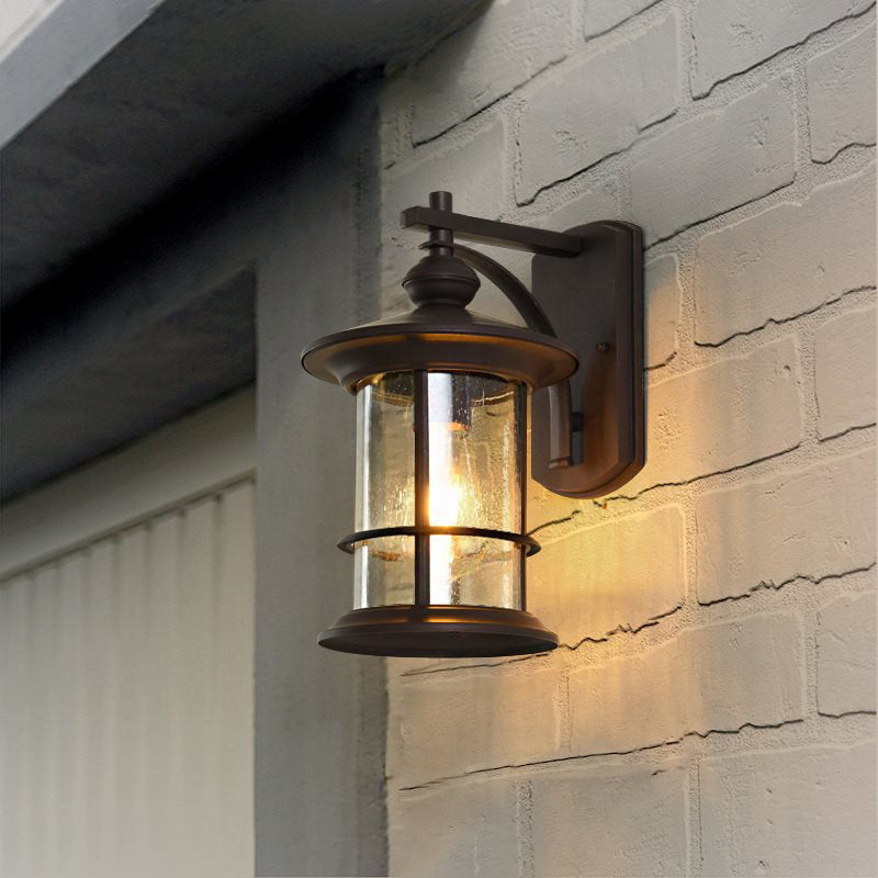 Skørter | Clear Seeded Glass Cylinder Wall Lamp Lodges 1-Bulb Outdoor Wall Mounted Lamp in Black/Brown for Garden