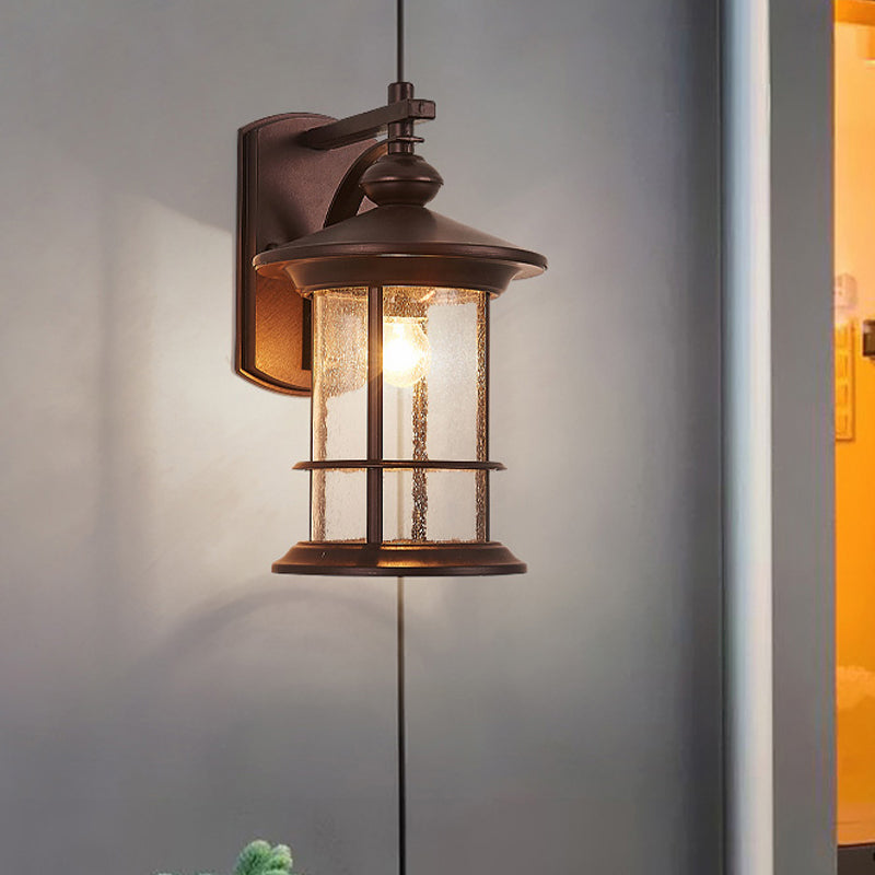 Skørter | Clear Seeded Glass Cylinder Wall Lamp Lodges 1-Bulb Outdoor Wall Mounted Lamp in Black/Brown for Garden