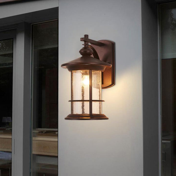 Skørter | Clear Seeded Glass Cylinder Wall Lamp Lodges 1-Bulb Outdoor Wall Mounted Lamp in Black/Brown for Garden