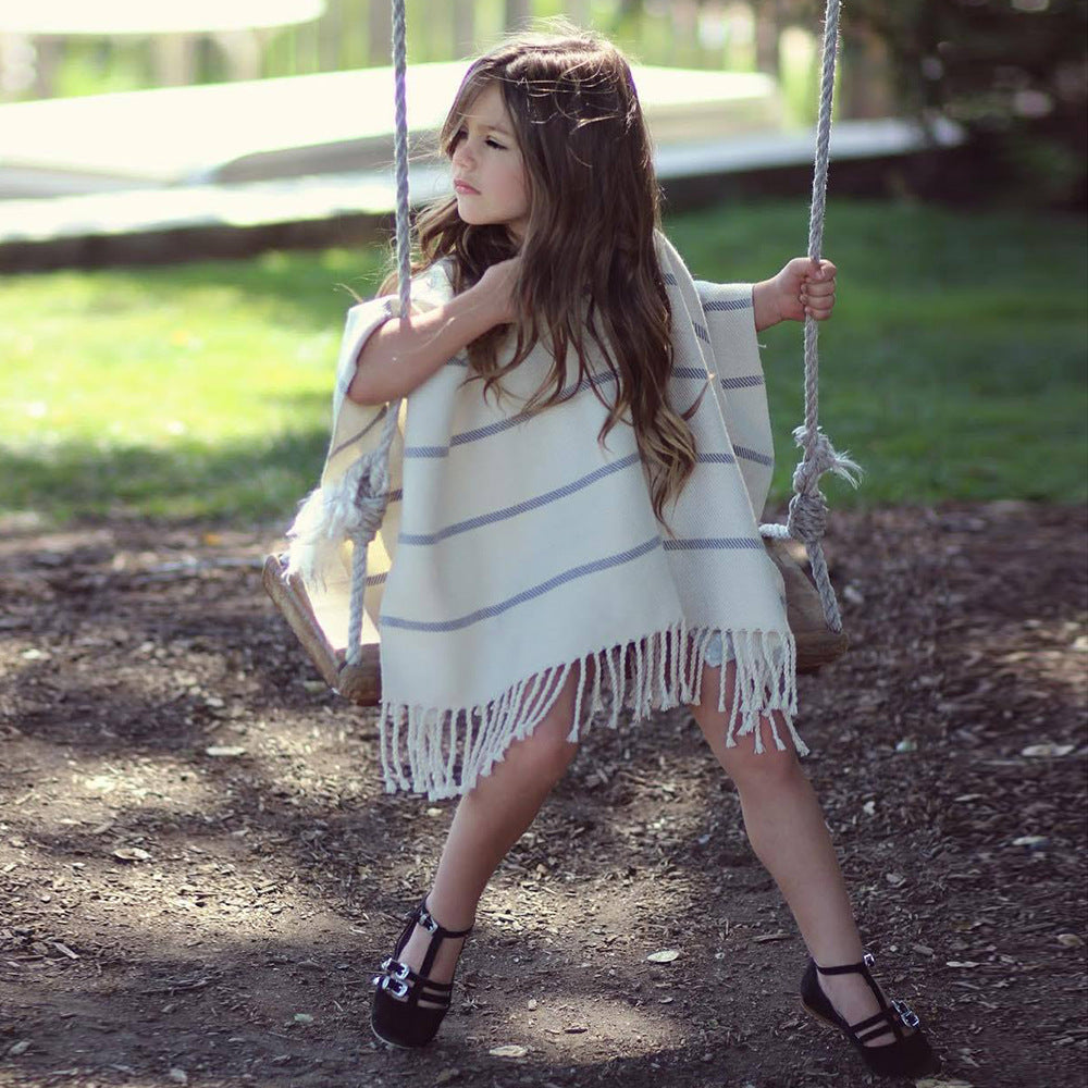 Women's beach poncho with fringed hem and striped design