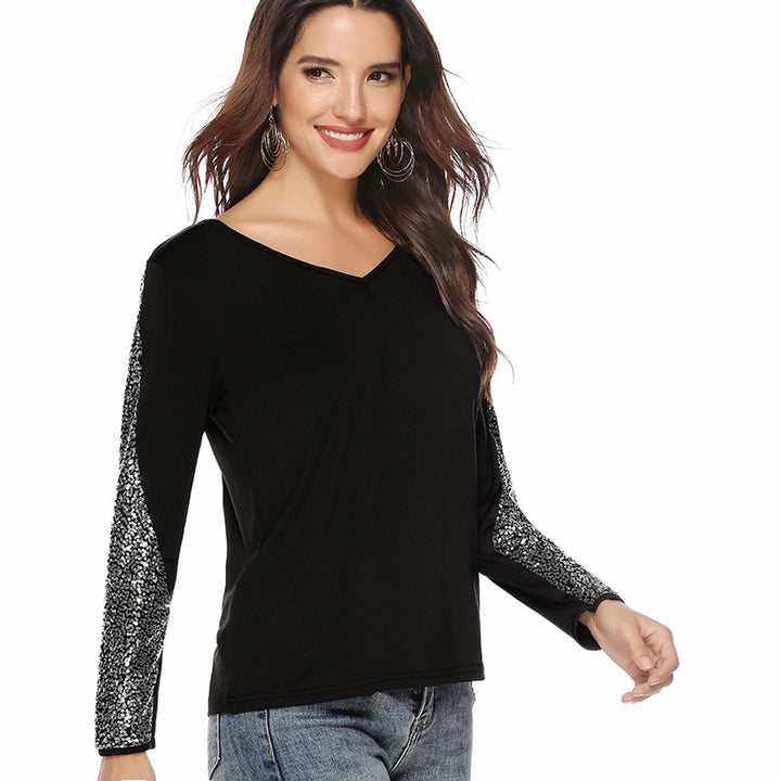 Women's elegant top with glittering sleeves and V-neck
