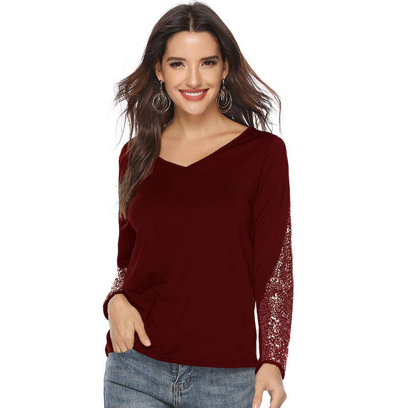 Women's elegant top with glittering sleeves and V-neck