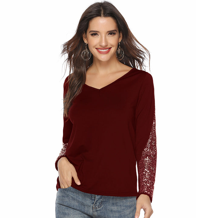 Women's elegant top with glittering sleeves and V-neck