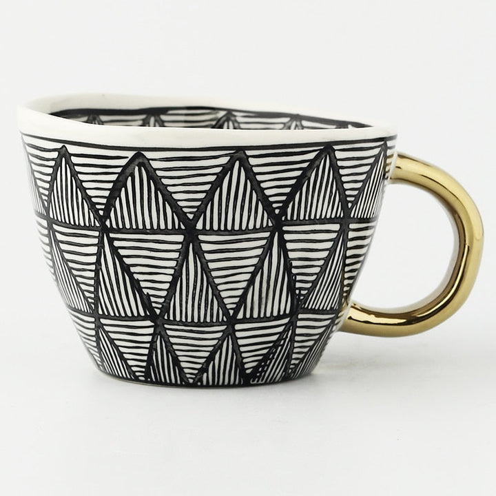 Lisslune | Cup with abstract geometric pattern and gold handle
