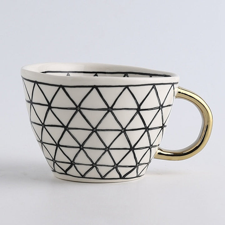 Lisslune | Cup with abstract geometric pattern and gold handle