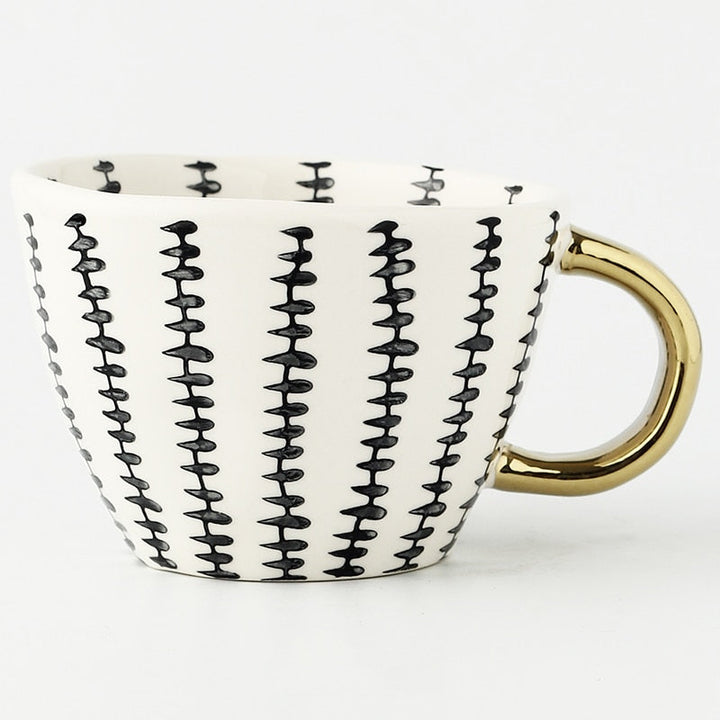 Lisslune | Cup with abstract geometric pattern and gold handle