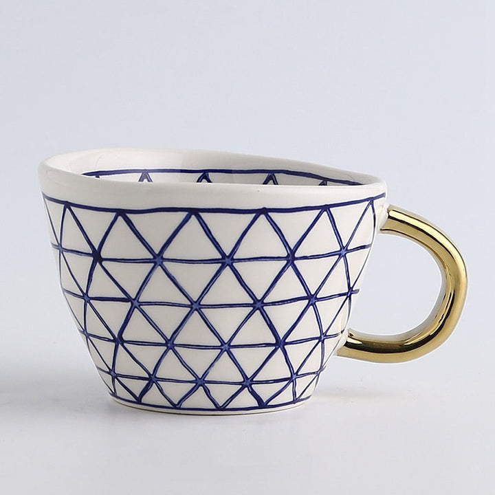 Lisslune | Cup with abstract geometric pattern and gold handle