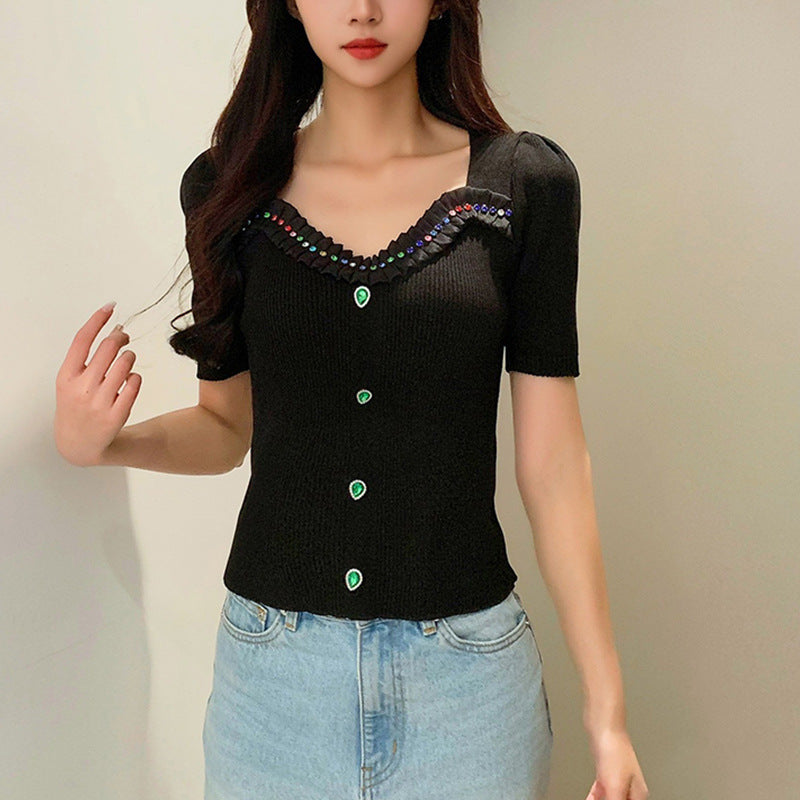 Women's fitted top with decorative button placket and fashionable V-neck