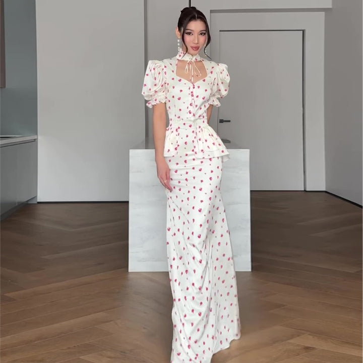 Women's maxi dress with romantic puff sleeve design and playful ruffle hem