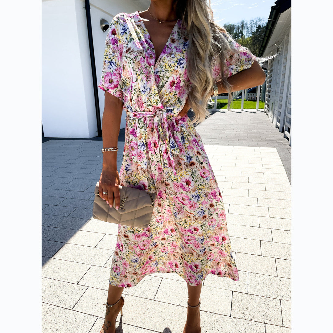Women's wrap dress with floral pattern and waist belt