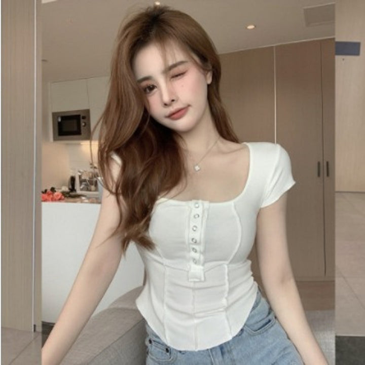 Women's fitted top with decorative press studs and square neckline