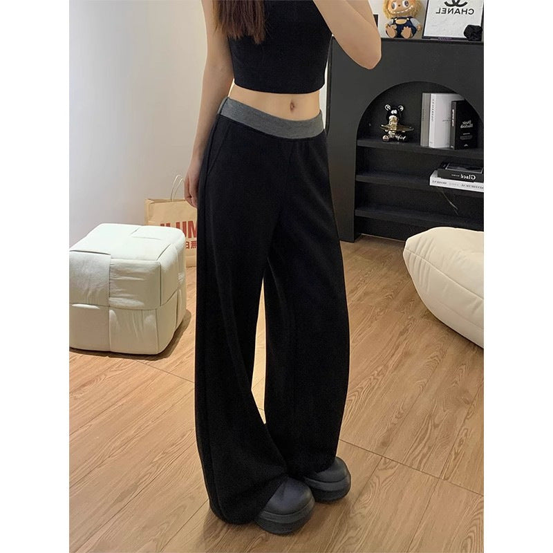 Women's casual fabric trousers with a wide cut and elastic waistband