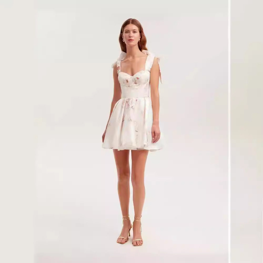 Women's Playful Mini Dress with Floral Design and Sophisticated Straps