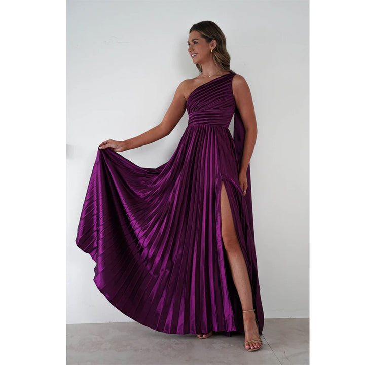 Ladies evening dress with elegant pleated skirt and asymmetric top