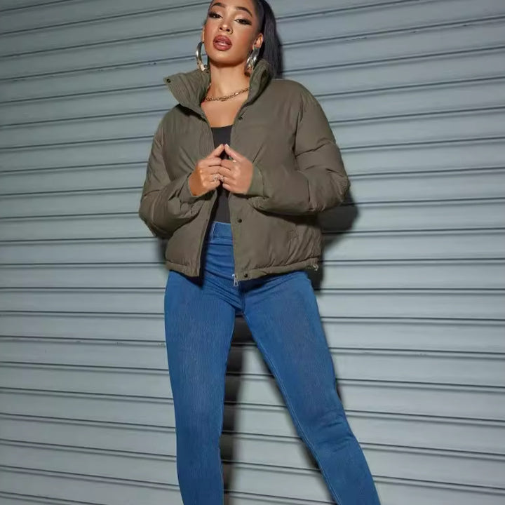 Women's quilted jacket with high collar and fitted cut
