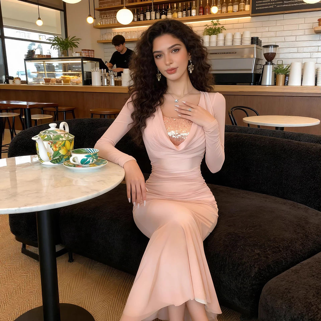Women's shimmering evening dress in elegant wrap style with sophisticated neckline and flowing skirt