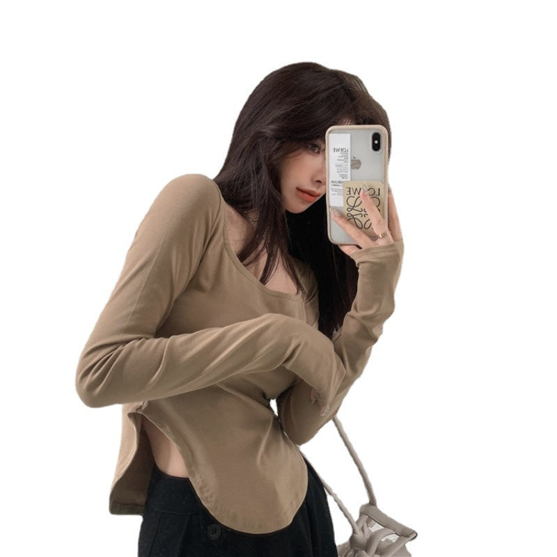 Women's long-sleeved top with elegant neckline and asymmetric design